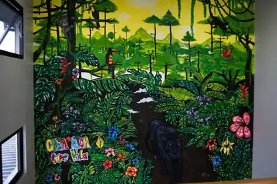 a wall with a painting of a forest at Cabina Alto San Juan l Mountain Luxury Getaway in San Juan