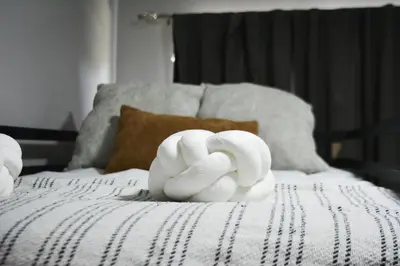 a white sculpture on top of a bed at Cabina Alto San Juan l Mountain Luxury Getaway in San Juan