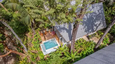 an overhead view of a house with a swimming pool in the forest at Casa Solana - Modern House with Ocean Views in Santa Teresa Beach