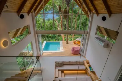 an internal view of a house with a pool at Casa Solana - Modern House with Ocean Views in Santa Teresa Beach