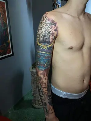 a man with a tattoo on his arm at Casita Pacifica in Playa Grande