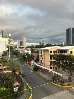 an aerial view of a city street with buildings at Chill Lodge Babylon Tower 506 in San José