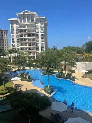a large swimming pool in a resort with buildings at Jacobay condominio 3303 in Jacó