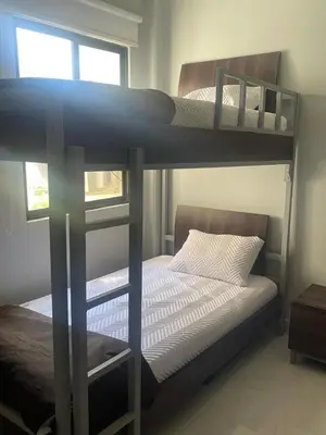 a bedroom with two bunk beds and a window at Jacobay condominio 3303 in Jacó