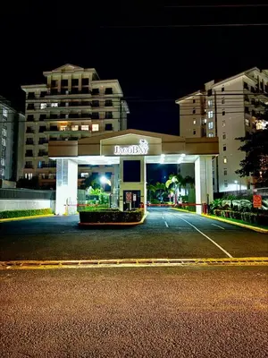 a mobil gas station at night in a parking lot at Jacobay condominio 3303 in Jacó