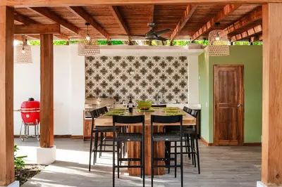 a kitchen and dining room with a table and chairs at Casa de Los Suenos in Potrero