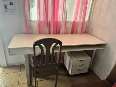 a desk with a chair in front of a window at Complete house for 6 people in Chiles