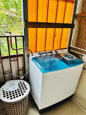 a washing machine sitting next to a window at Complete house for 6 people in Chiles