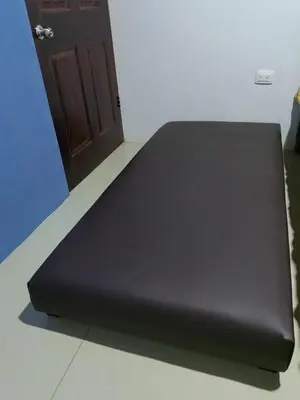 a black bed in a room with a door at SJO - Casa Taccari in Grecia