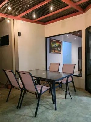 a black table and chairs in a room at SJO - Casa Taccari in Grecia