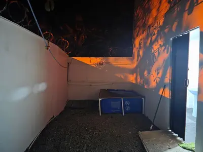 a small room with a table and a wall at WAVESCRhouse1 in Parrita