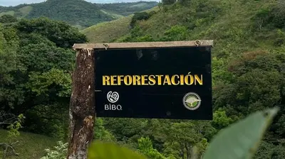 a sign on a hill with a forest at BìBO Horizon House in Monteverde Costa Rica