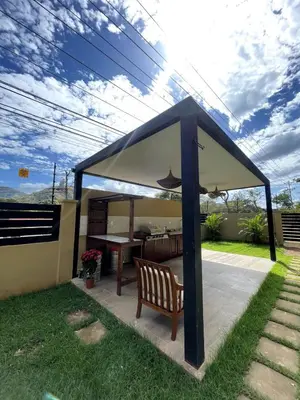 a gazebo with a chair and a table at Casa Blue in Brasilito