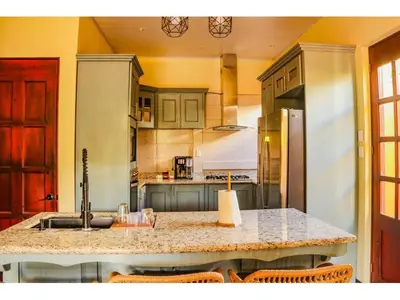 a kitchen with a sink and a counter top at Casa Blue in Brasilito