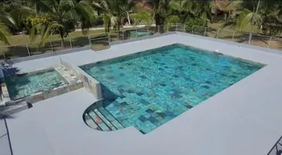 an overhead view of a large swimming pool at Tree House River in Palma