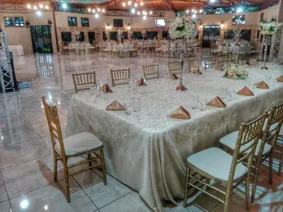 a long table in a banquet hall with chairs at Hotel Cibeles Resort in Heredia