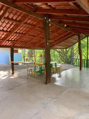 a large pavilion with a table and chairs in it at Cabañas Luz de Luna
