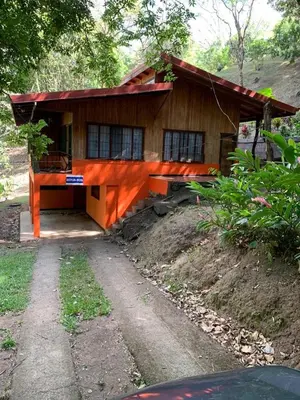 a small house with a pathway in front of it at Cabañas Luz de Luna