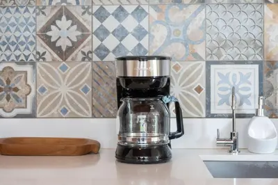 a coffee maker sitting on a counter next to a sink at Villa Girasole - Villaggio 6 in Potrero