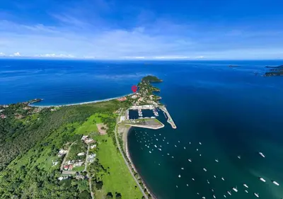 an island in the ocean with boats in the water at Playa Flamingo Ocean View Retreat in Playa Flamingo