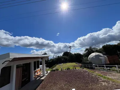 a view of a house with the sky in the background at Green haven in Alajuela City
