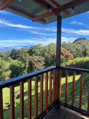 a view from the deck of a cabin in the woods at Cabaña el mirador in Empalme