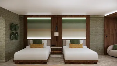 two beds in a room with two windows at Montara Hotel, Tapestry Collection By Hilton in Heredia