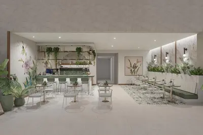 a restaurant with tables and chairs and plants at Montara Hotel, Tapestry Collection By Hilton in Heredia