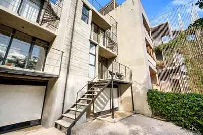 a staircase on the side of a building at TL1 Bright Stylish Loft with Green Views in Tamarindo