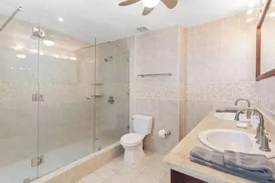 a bathroom with a shower and a toilet and a sink at Stunning Ocean-View 2 BD Overlooking Tamarindo in Tamarindo