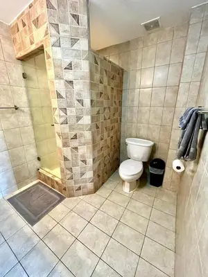 a bathroom with a toilet and a shower at Stunning Ocean-View 2 BD Overlooking Tamarindo in Tamarindo