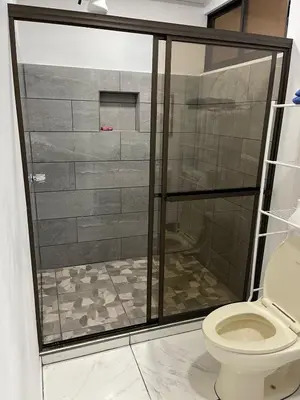 a bathroom with a shower with a toilet at La Casita in San Isidro