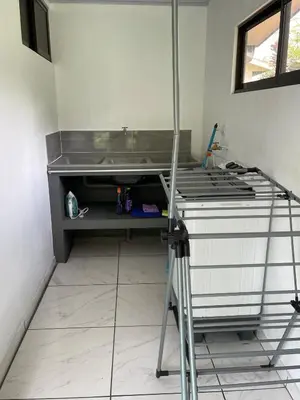 a kitchen with a stove top in a room at La Casita in San Isidro