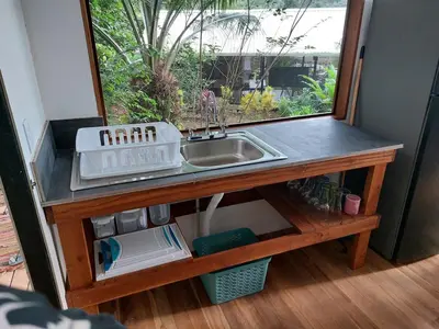 a kitchen counter with a sink and a window at Jungle Studio in Drake Bay in Drake