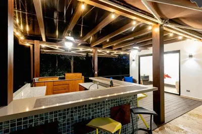 a kitchen with a sink and a counter top at Private Pool Luxury Modern House - Llama del Bosque - Reserva Conchal Golf Resort in Playa Conchal