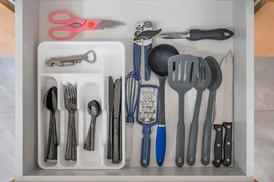 a drawer filled with kitchen utensils and scissors at Casa Mango - Villaggio 6 in Potrero