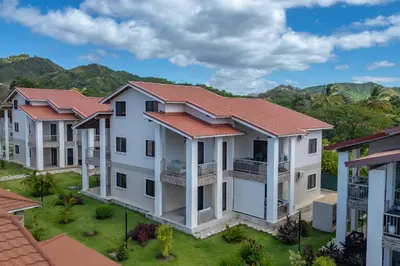 a row of houses with mountains in the background at Casa Mango - Villaggio 6 in Potrero