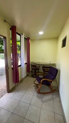 a living room with a table and a chair at Casa Antioquia #4 in Garita