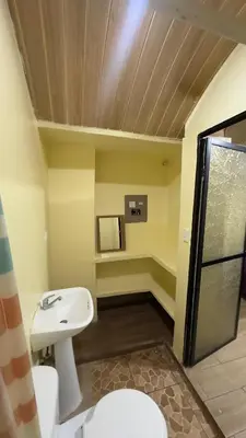 a bathroom with a sink and a toilet at Casa Antioquia #4 in Garita