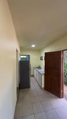 a kitchen with a refrigerator and a sink in it at Casa Antioquia #4 in Garita