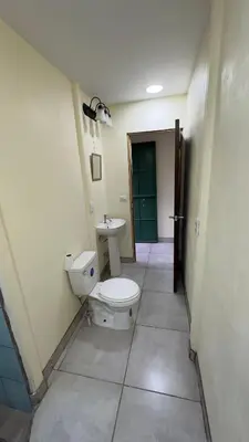 a bathroom with a toilet and a sink at Casa Antioquia #2 in Garita