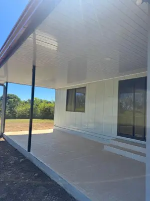 a white building with windows on the side of it at Casa Tano in Tapantí