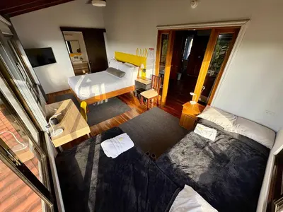 an overhead view of a living room with a bed and a couch at Hotel Honey Bee in Alajuela City
