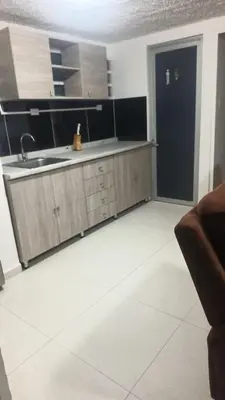 a kitchen with a sink and a counter top at Cerca estadio Nacional in San José