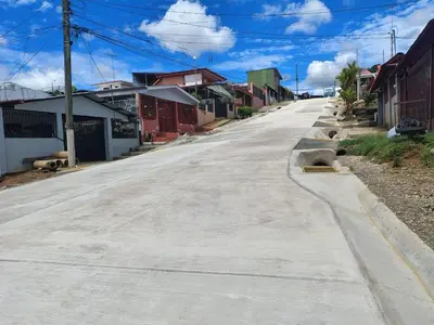 an empty street in a small town with houses at Complete house for 6 people in San Isidro