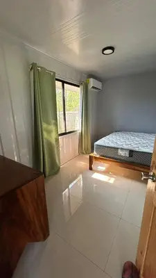 a small room with a bed and a window at Casa Tano in Delicias