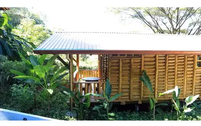 a small cabin with a table and a roof at Cabañas Samara Buenavista in Sámara