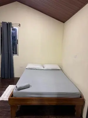 a large bed in a room with at Casa lapas in San Isidro