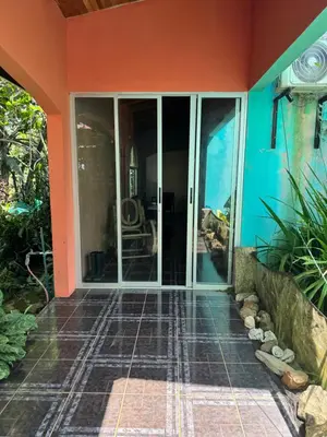 a room with sliding glass doors on a house at Relaxed delfin in Monterrey