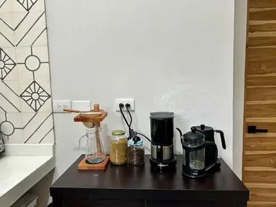 a table with a coffee maker on it in a kitchen at Cabin Retreat - Nature & Privacy - La Fortuna in Fortuna
